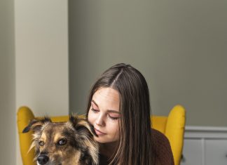 woman-armchair-with-her-dog-pandemic