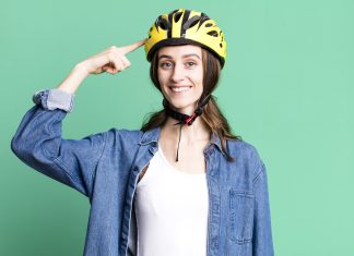 young pretty woman with a bike helmet