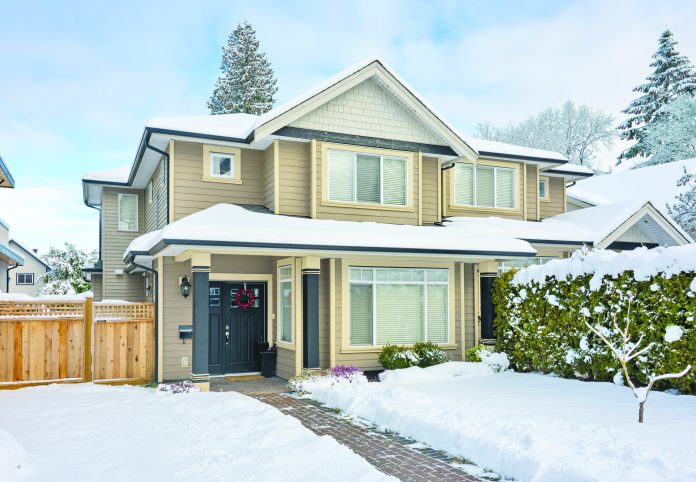 ntrance of nice residential house in snow