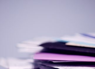 Stack of papers and multicoloured files