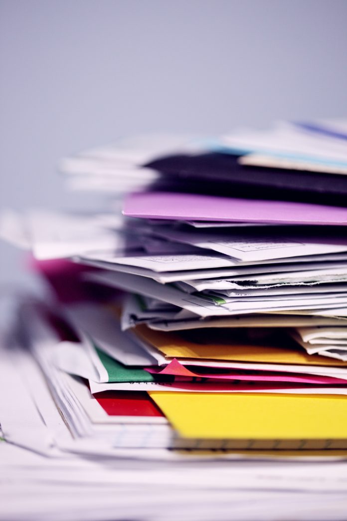 Stack of papers and multicoloured files
