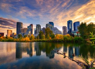 Sunset above city skyline of Calgary with Bow River, Canada